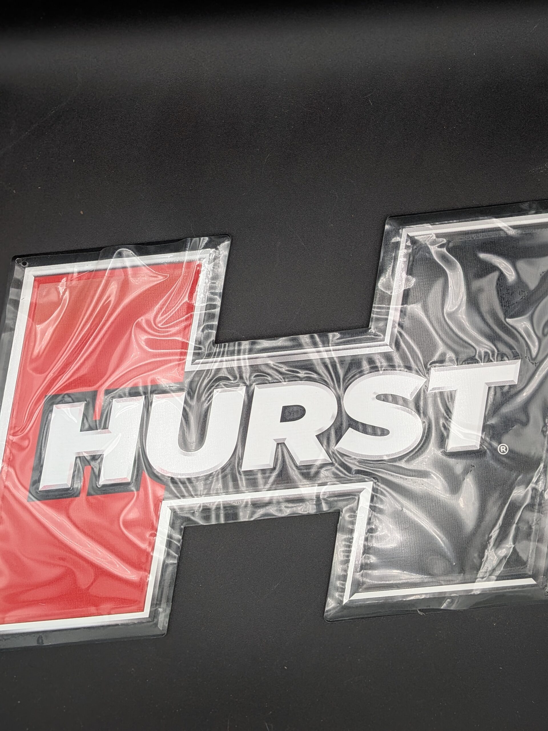 PXL_20251210_221157612.PORTRAIT Hurst Embossed Metal Sign (P/N 669966)