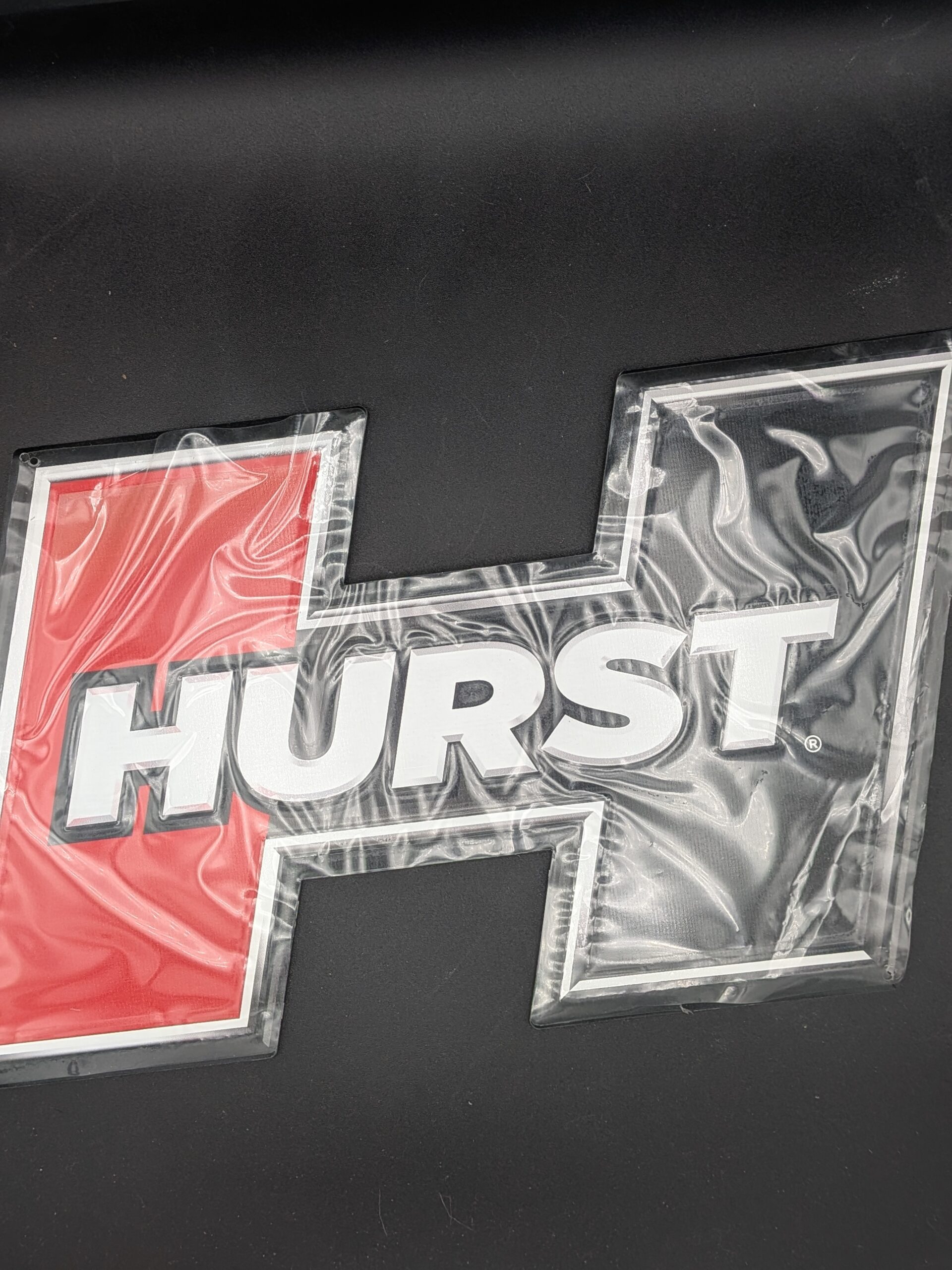 PXL_20251210_221201430.PORTRAIT.ORIGINAL Hurst Embossed Metal Sign (P/N 669966)