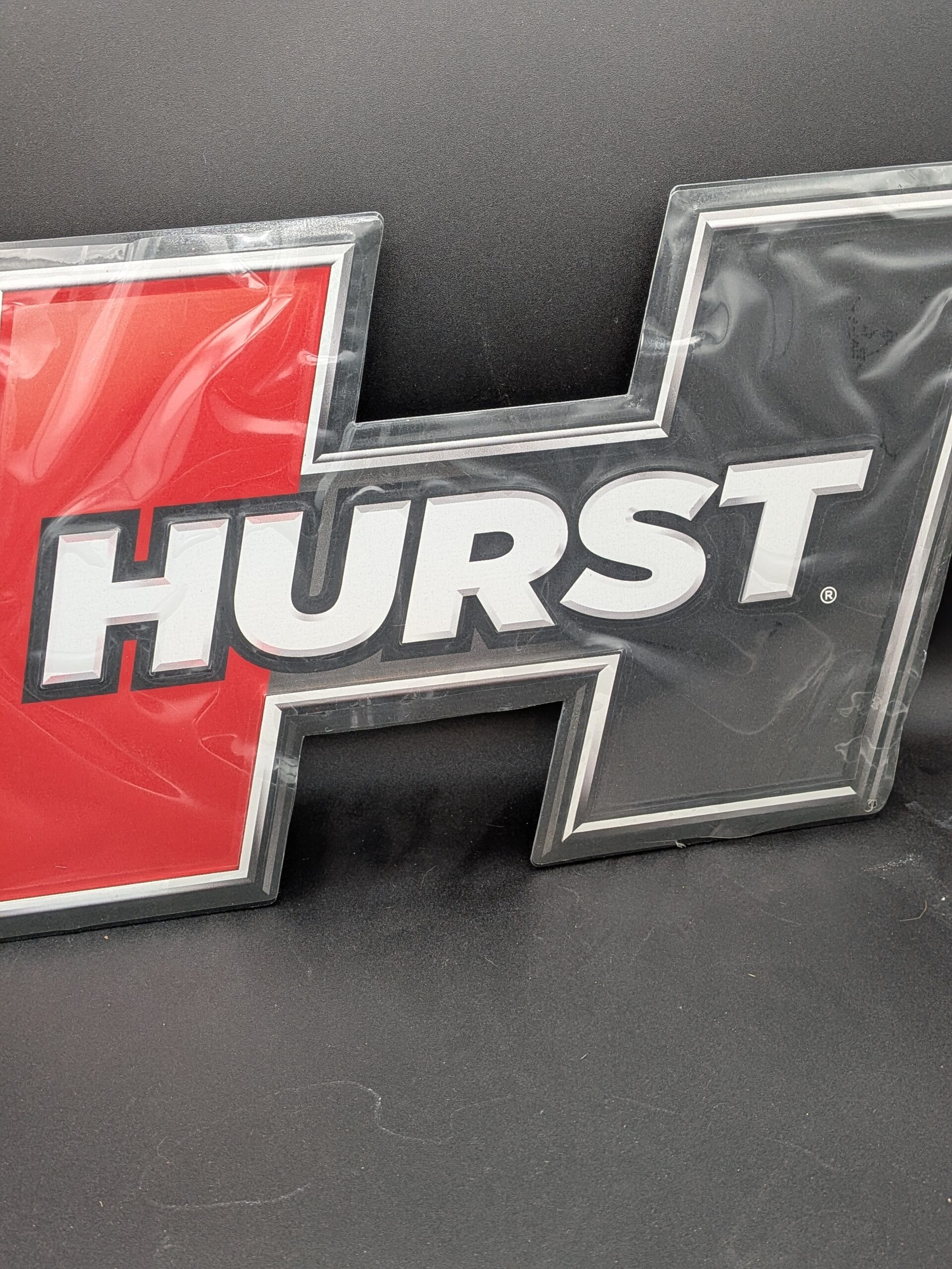 PXL_20251210_221213970 Hurst Embossed Metal Sign (P/N 669966)